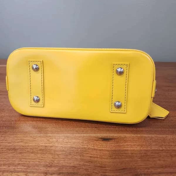 Louis Vuitton Alma Yellow Epi Leather Handbag, close-up view