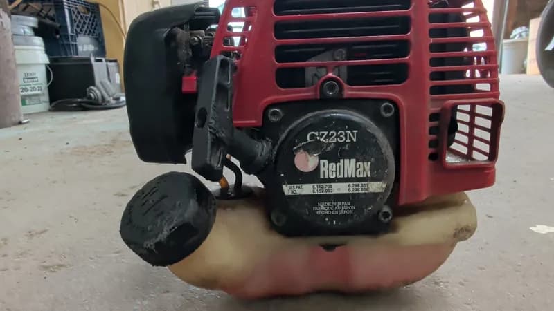 RedMax C-Z23N Gas String Trimmer w/ Shoulder Strap, side view
