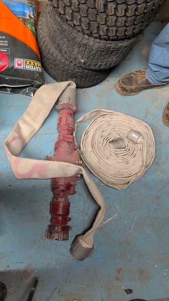 Fire Hose Assembly w/ Nozzle and Canvas Coupling, primary view