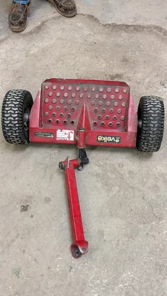 Red Utility Trailer with Perforated Steel Deck, primary view