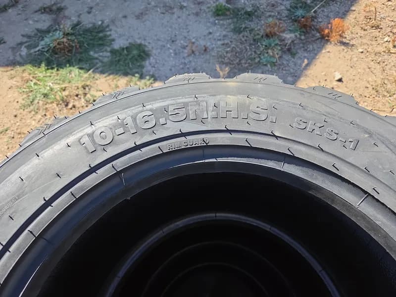 Set of 4 New Skid Steer Tires 10-16.5 SKS-1, rear view
