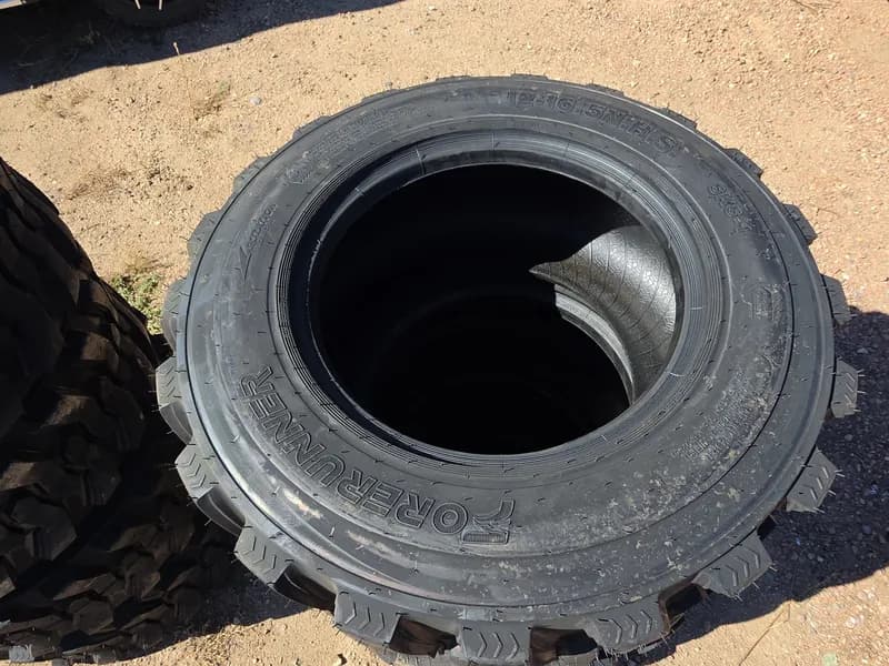 Set of 4 New Tires for Skid Steer 12-16.5 SKS-1, side view