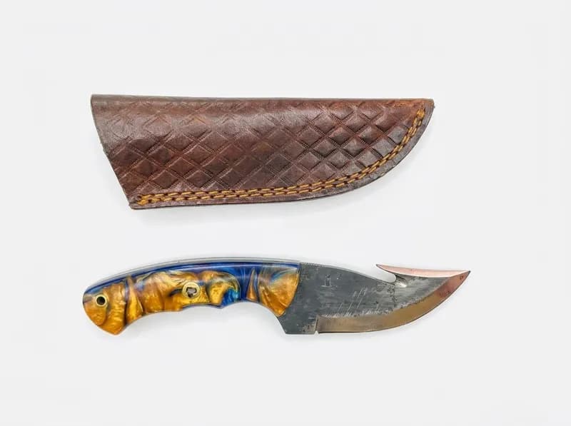 Fixed Blade Gut Hook Knife with Blue and Amber Resin Handle and Leather Sheath, primary view