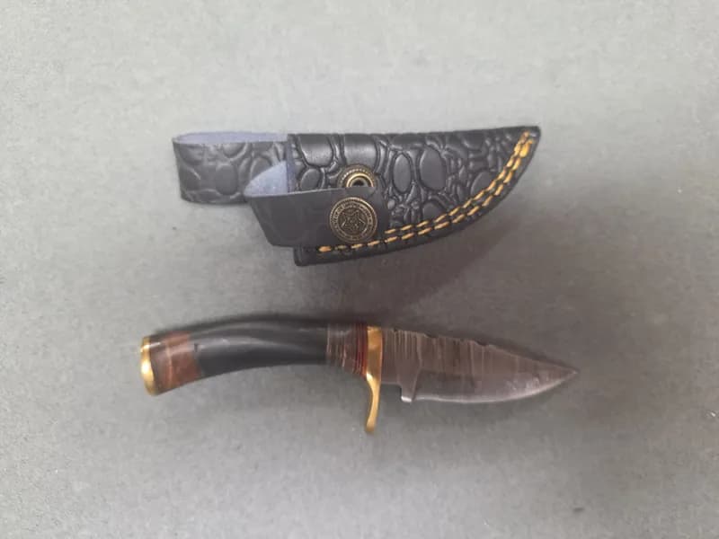 Fixed Blade Knife with Patterned Blade, Brass Guard and Leather Sheath, side view