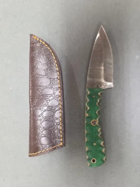 Fixed Blade Knife with Green Patterned Handle and Brown Leather-Style Sheath, side view
