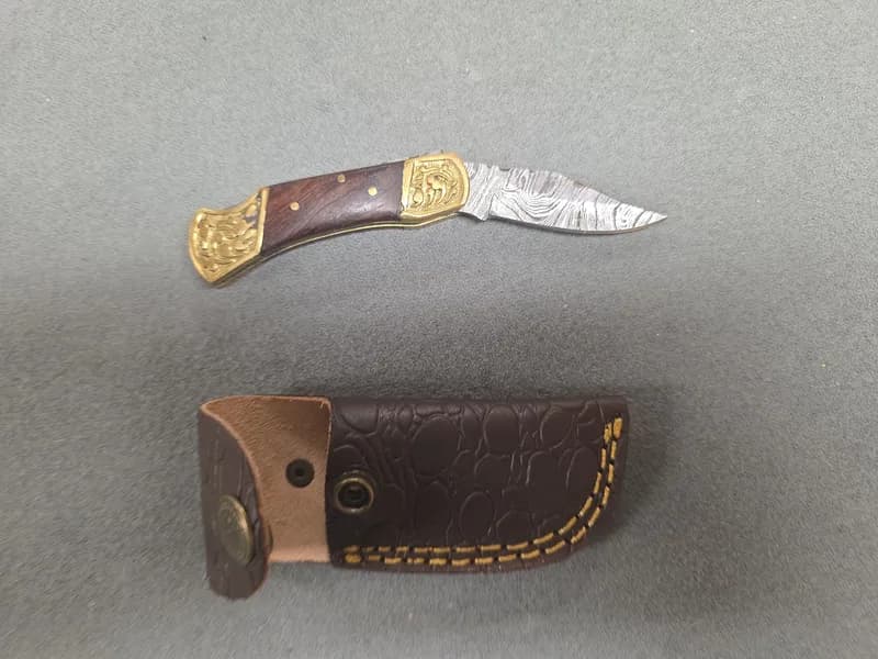 Damascus-Pattern Folding Pocket Knife w/ Brass Bolsters & Leather Sheath, side view